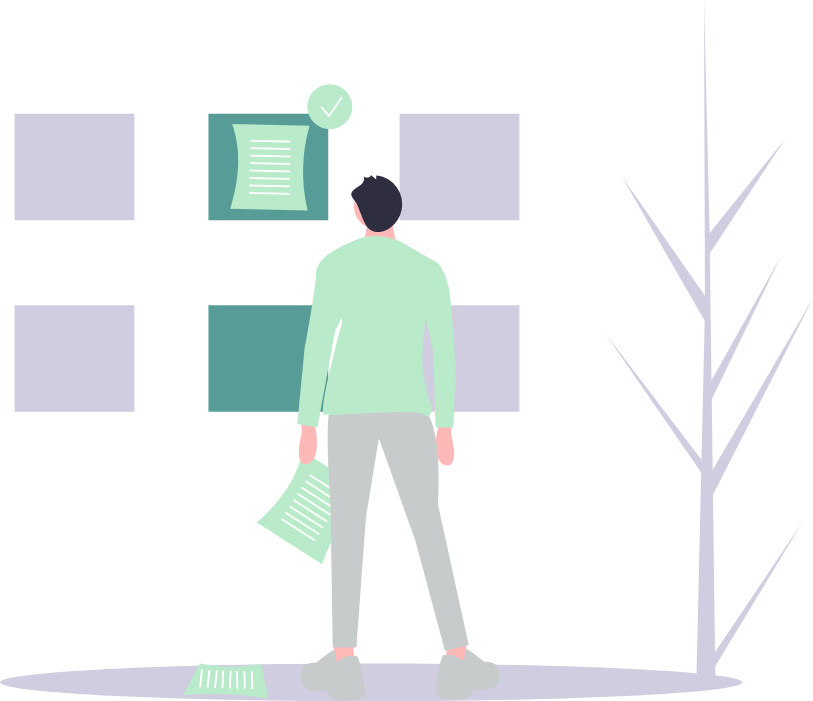 Person standing an looking at boxes on a wall